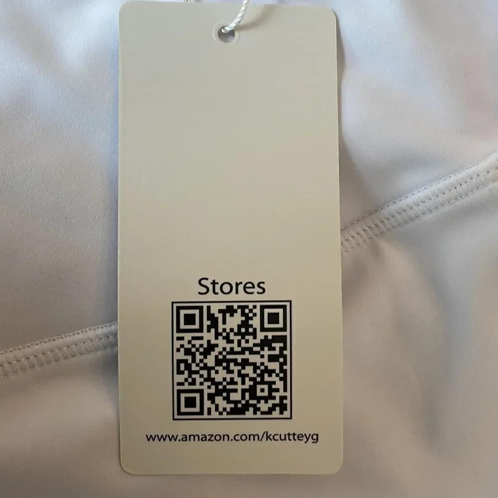 Kcutteyg white exercise capris with side pockets.  New with tags